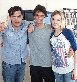 Photo of reporter Jake Carroll flanked by Joe Wright and Saoirse Ronan
