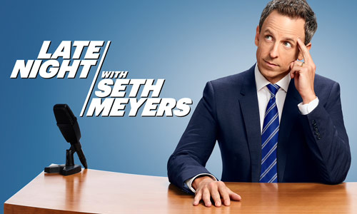 Image of Seth Meyers seated at desk