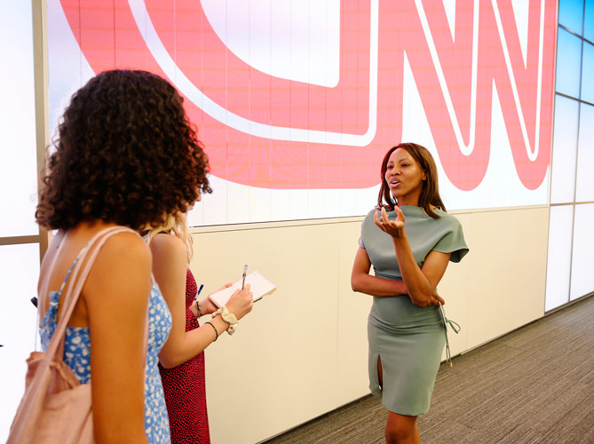 Image of CNN Anchor Zain Asher speaking with a group of FastForward reporters